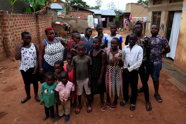 Mariam Nabatanzi with some of her 38 children at their home in Kasawo village, Uganda