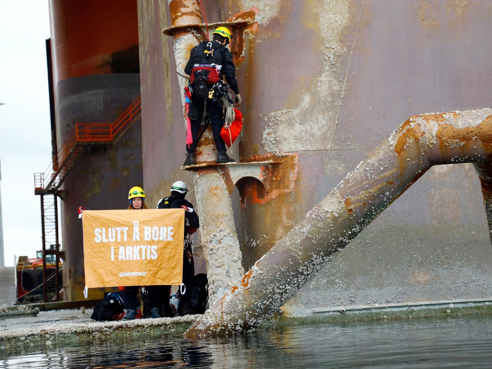 'Stop Drilling in the Arctic', reads a banner held by Greenpeace activists on the Equinor oil rig