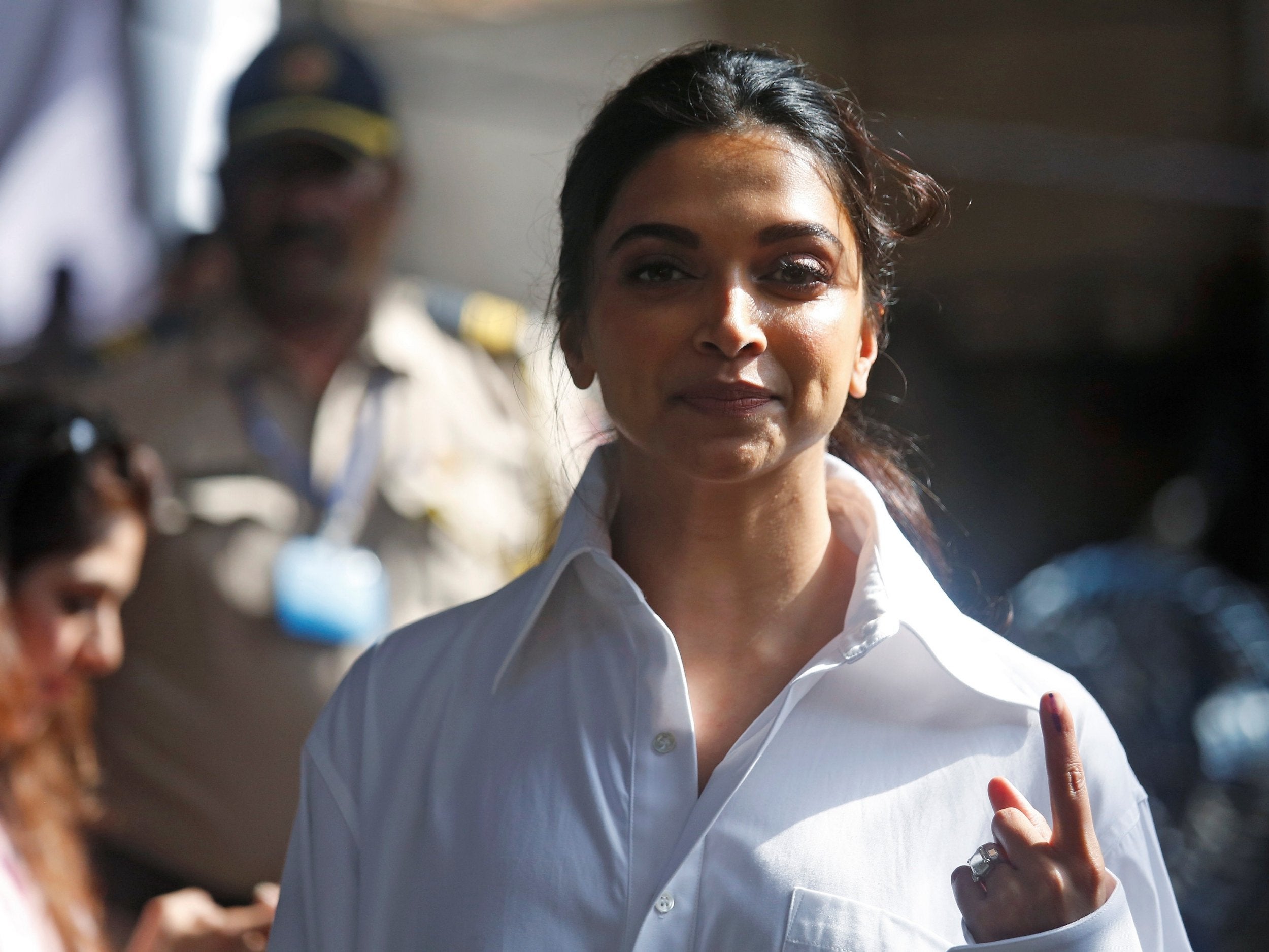 Bollywood’s highest-paid actress, Deepika Padukone, shows an ink mark on her finger after casting her vote at a polling station in Mumbai (Reuters)