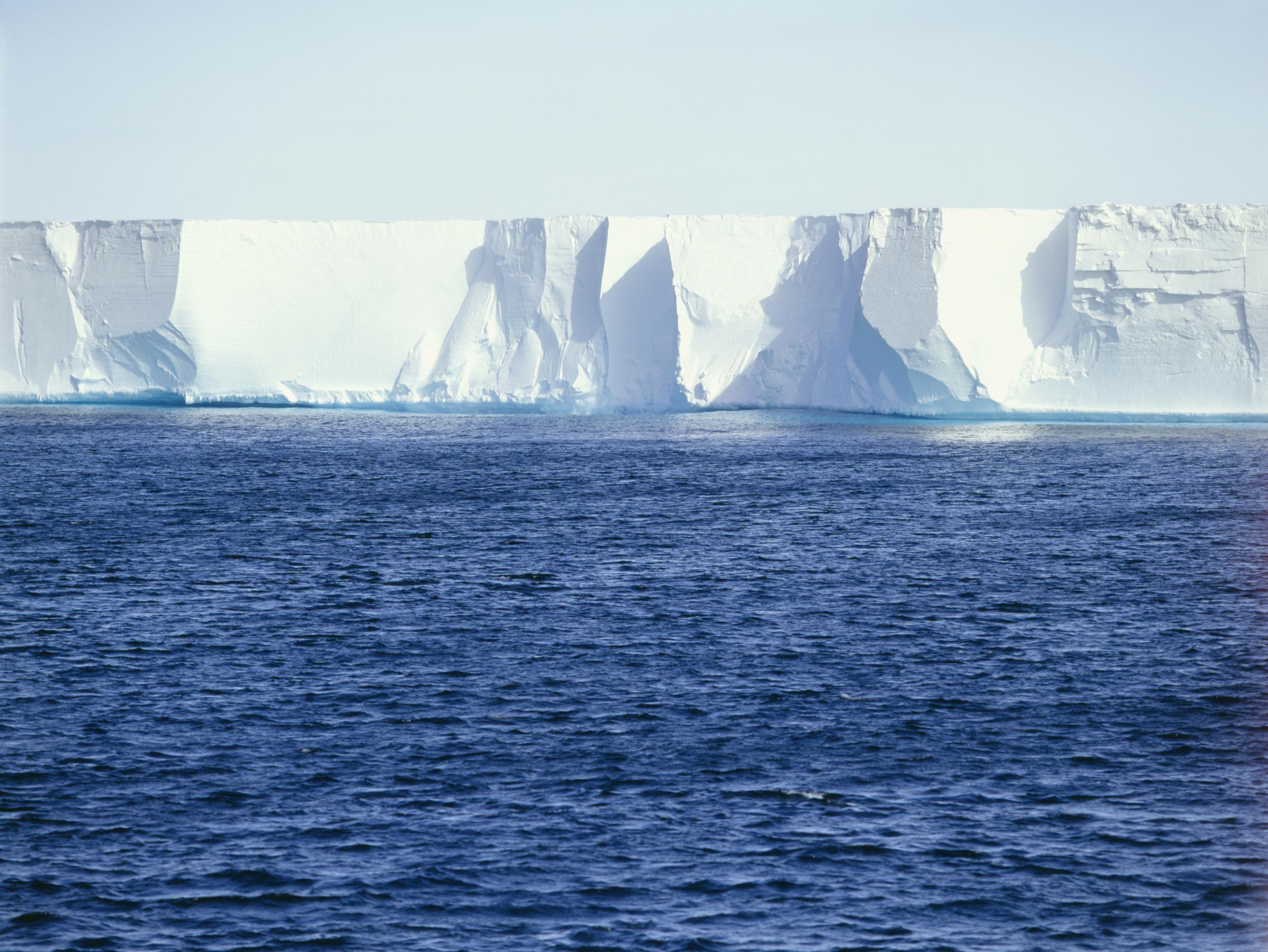 The vertical ice cliff to the open ocean is more than 350 miles long and is up to 50m high above sea level