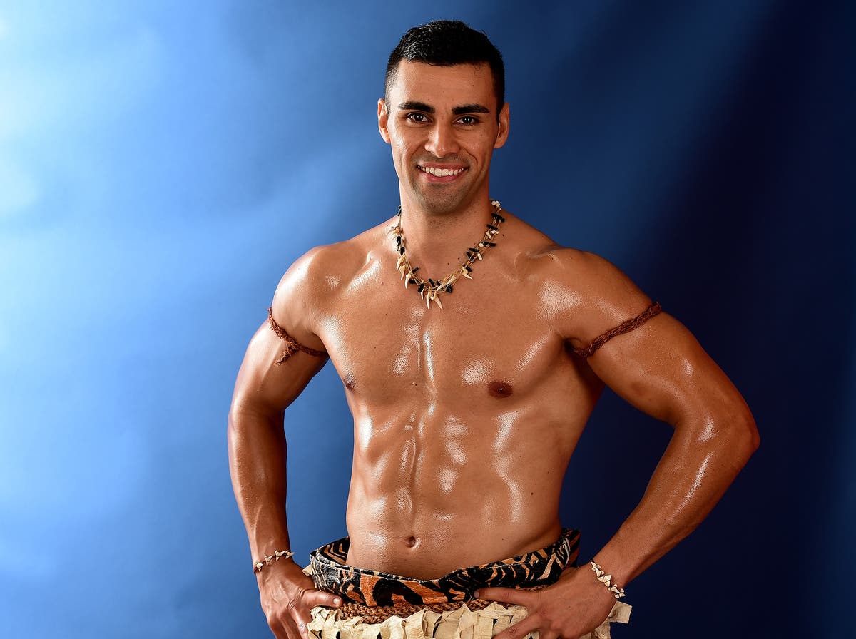 Topless Tongan Olympic flag-bearer raises &pound;290,000 in disaster aid