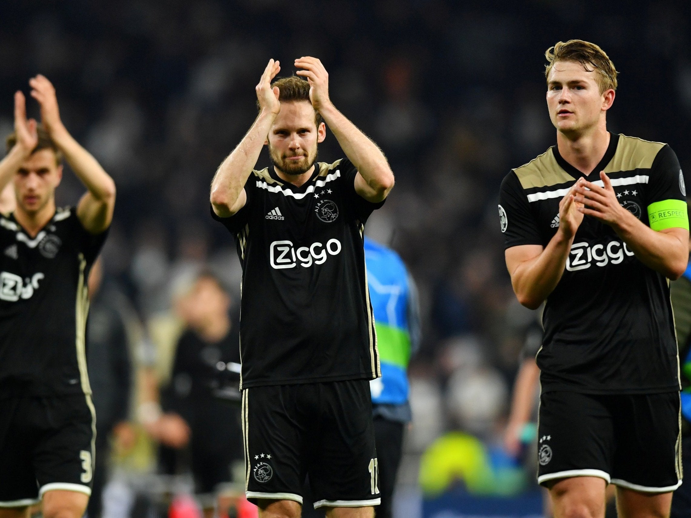 Daley Blind and Matthijs De Ligt applaud the Ajax fans