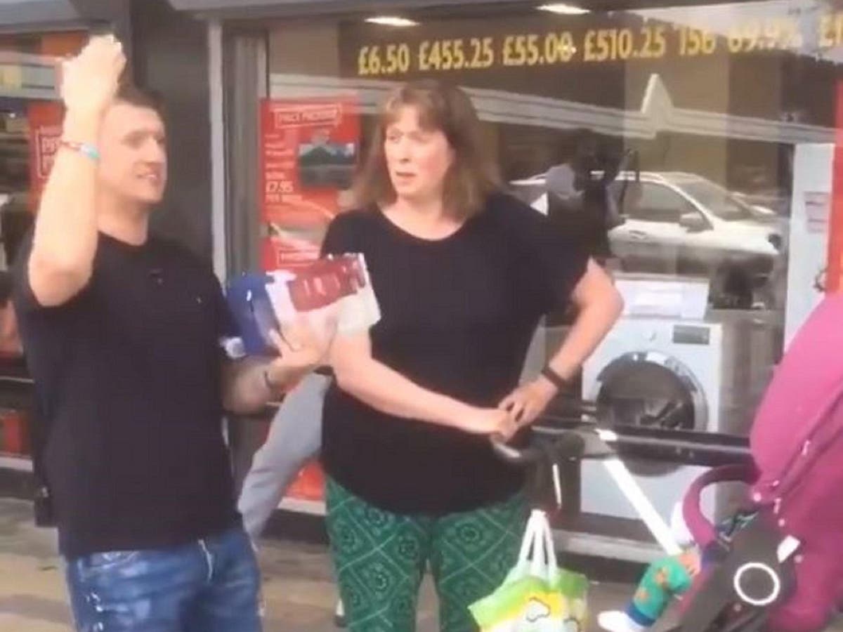 Woman asks Tommy Robinson 'are you just spouting s****?' when he tries to recruit her on street in Salford