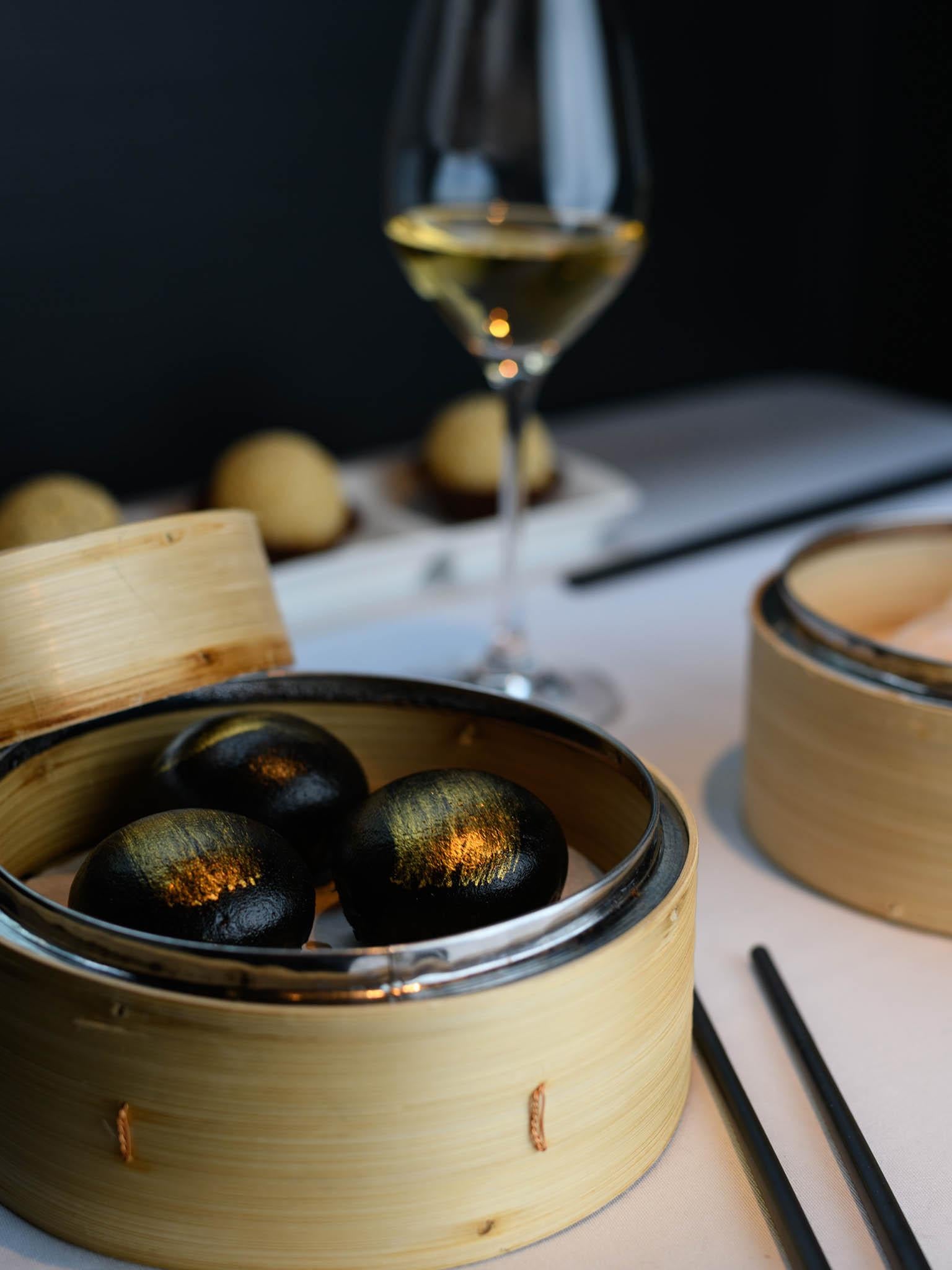 Steamed charcoal buns with custard sets the bar for what you can expect here