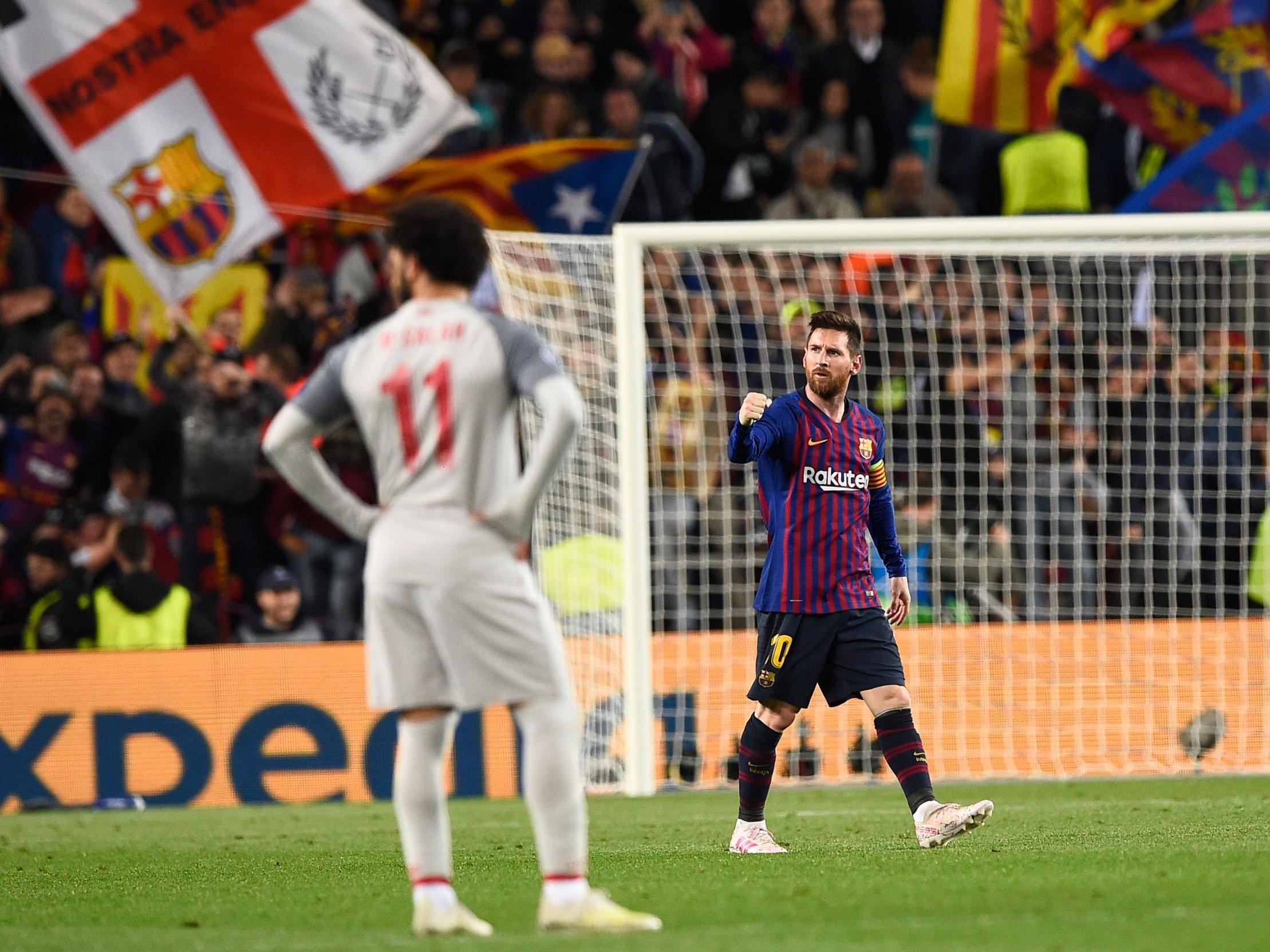 Mohamed Salah looks on as Lionel Messi celebrates his second