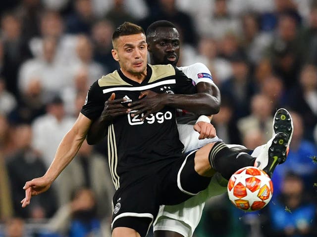 Ajax's Dusan Tadic in action with Tottenham's Davinson Sanchez