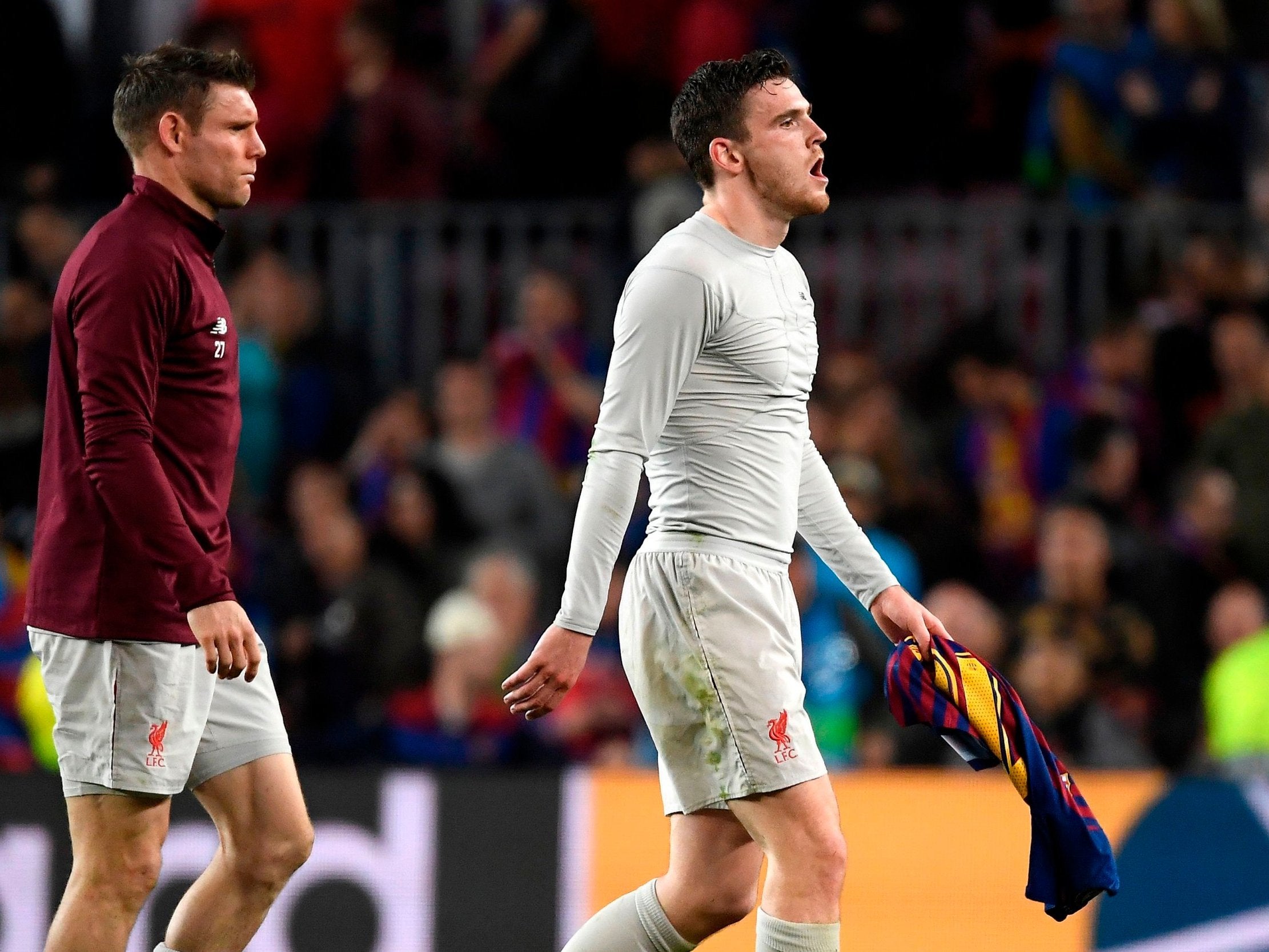 James Milner and Andrew Robertson look dejected after defeat in Barcelona