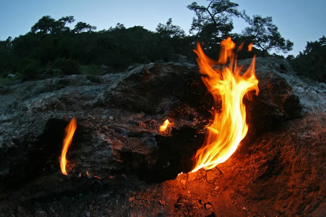 The Flames of Chimaera in Turkey are produced by a gas escaping from deep within the earth produced by chemosynthesis, a chemical reaction inside rocks
