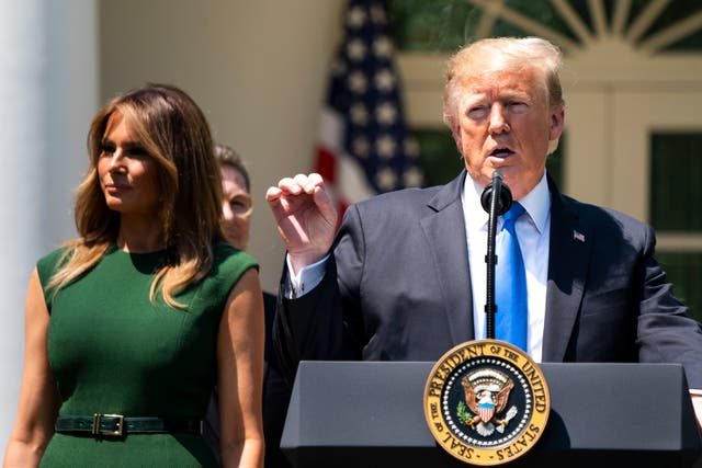 US president Donald Trump and first lady Melania Trump speak at a National Day of Prayer service in the Rose Garden of the White House in Washington, DC, on 2 May 2019