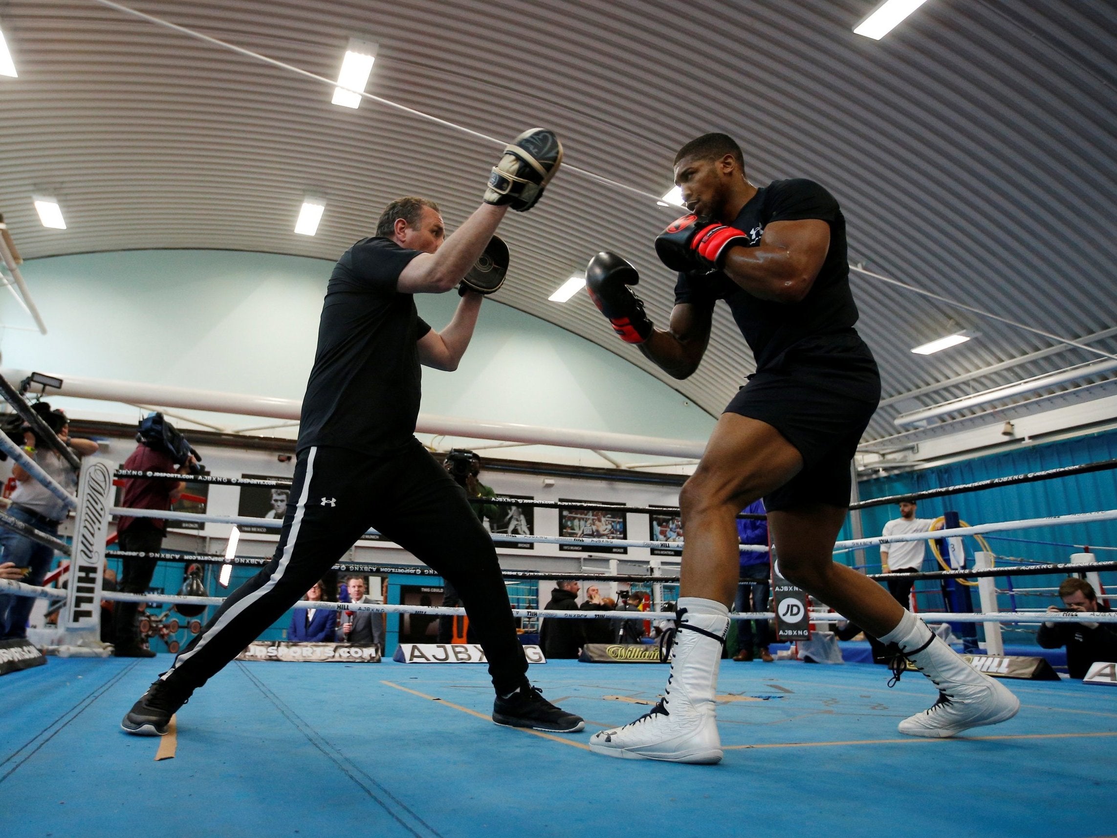 Anthony Joshua on the pads with trainer Robert McCracken