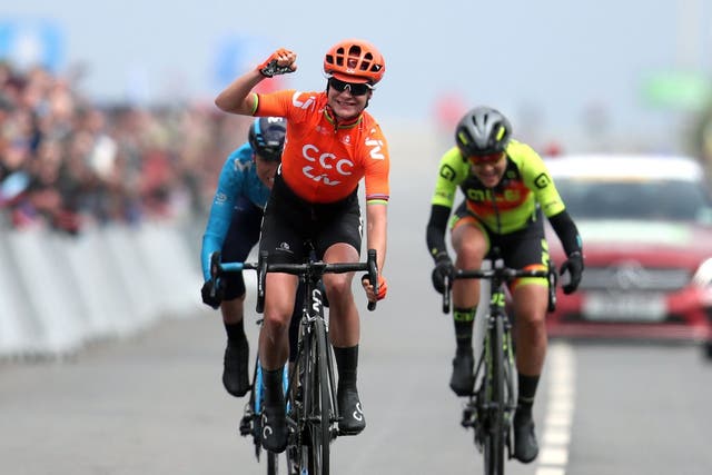Marianne Vos celebrates as she crosses the finish line on stage two to win the Tour de Yorkshire