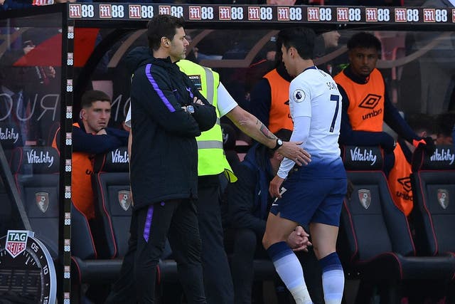 Mauricio Pochettino looks on after Son Heung-min is sent off for Spurs in their defeat at Bournemouth