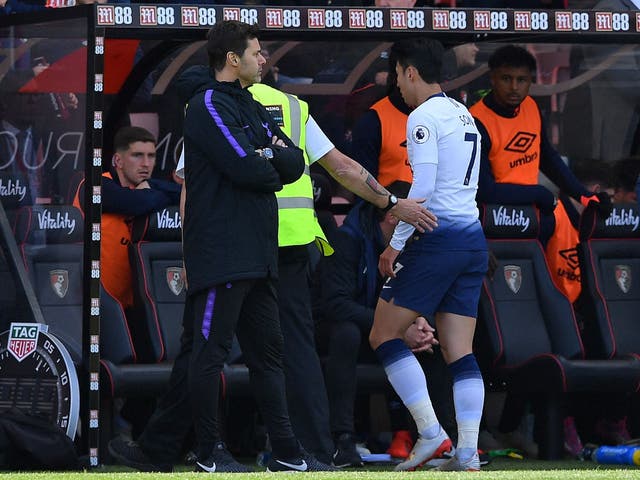 Mauricio Pochettino looks on after Son Heung-min is sent off for Spurs in their defeat at Bournemouth
