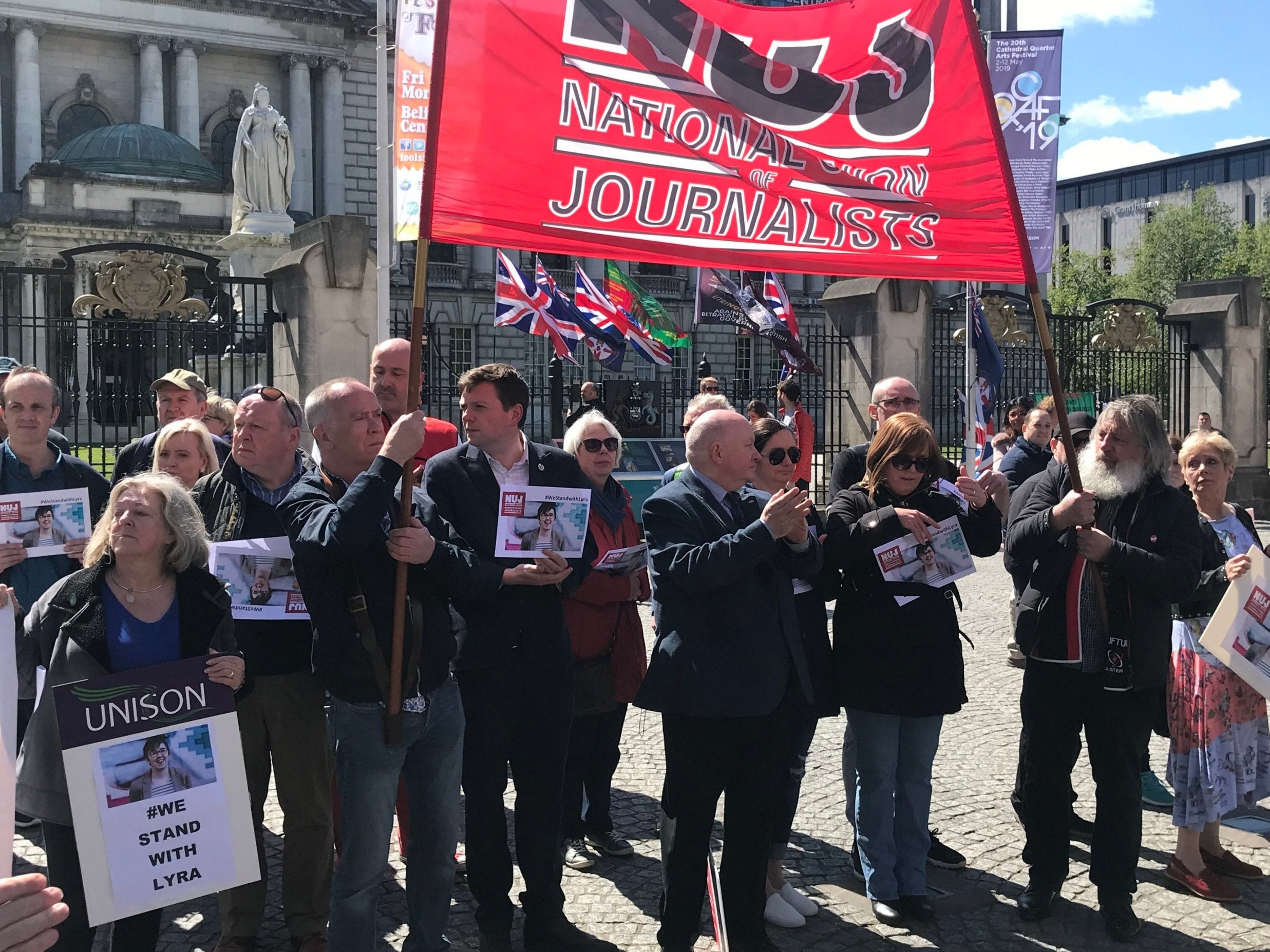 Members of the NUJ pause at Belfast City Hall to remember Lyra McKee on Saturday