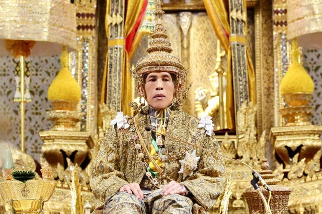 Thailand's King Maha Vajiralongkorn sits on the throne during his coronation inside the Grand Palace in Bangkok