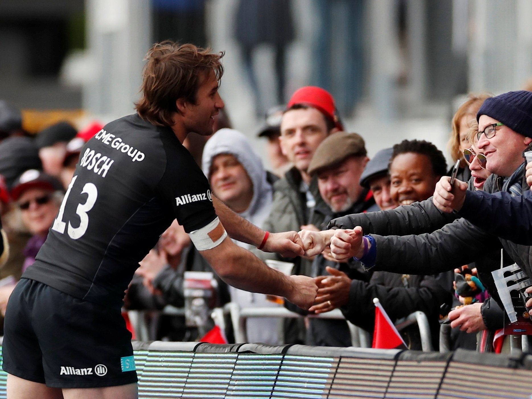 Marcelo Bosch celebrates with fans after Saracens' victory