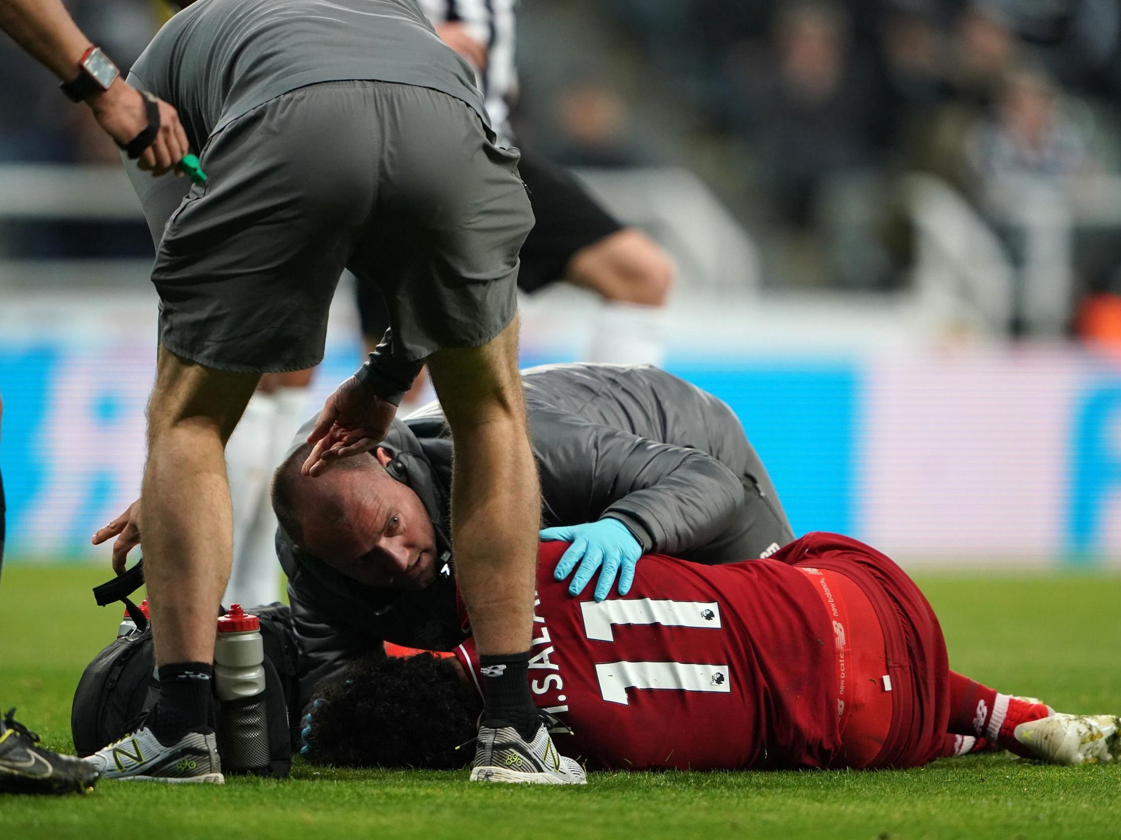 Salah is treated for a head injury