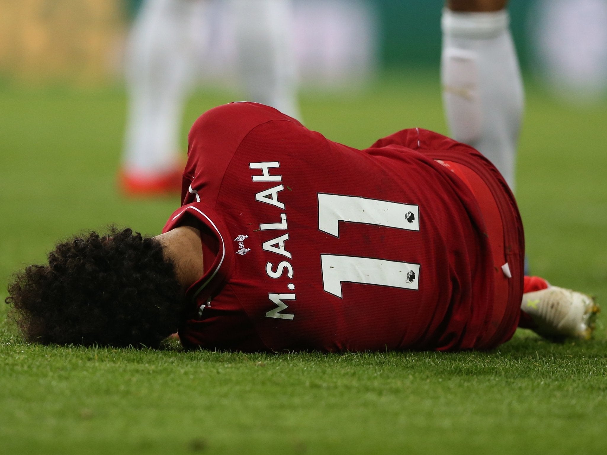 Salah appeared to be unconscious after hitting the floor