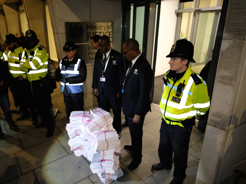 Protesters dump documents representing rape victims’ phone data outside the CPS’s offices in November (Sisters Uncut)