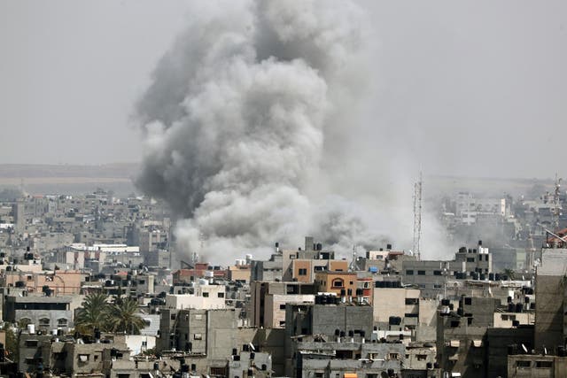 Smoke rises from a building in the Gaza Strip.