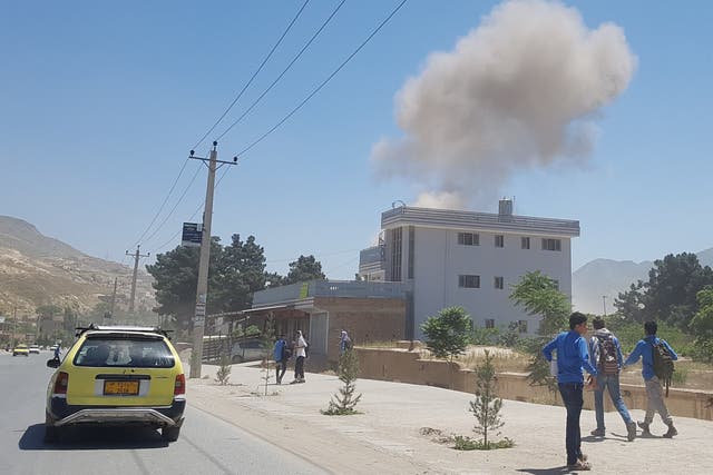 A government official said the bomber blew up a Humvee loaded with explosives outside the police headquarters in Pul-e-Khumri