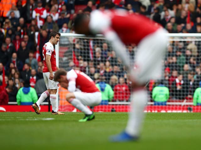 Arsenal look dejected after drawing with Brighton