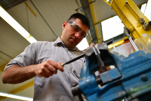 Alan Ramadan, a refugee from Syria who came to Germany in 2012, attends a job training programme as an industrial mechanic in Hanover