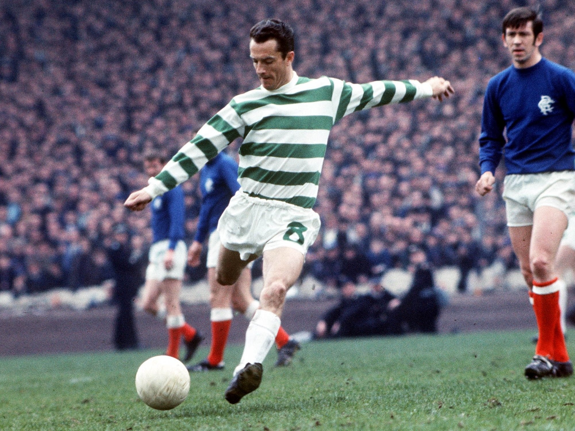 Chalmers in action against Rangers (and their captain John Greig, right) in 1969