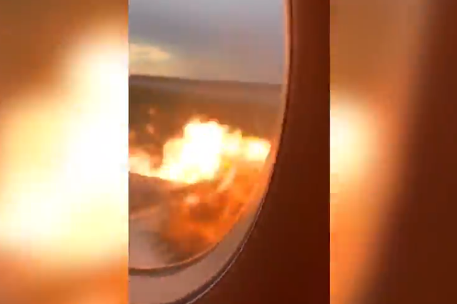 The video, taken by a passenger, appears to show the plane’s wing on fire out of the window while screaming can be heard in the background