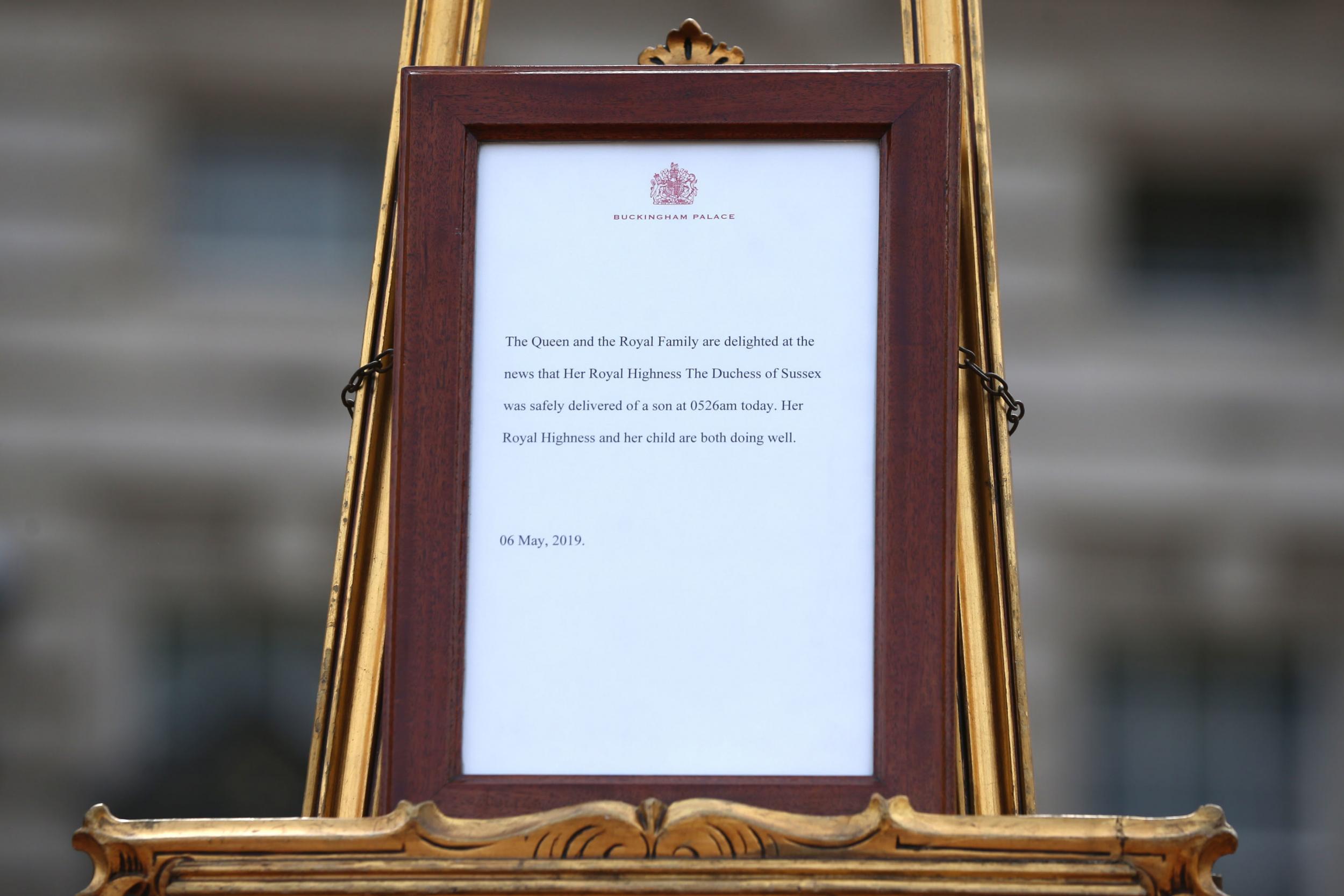 A picture shows an official notice set up on an easel at the gates of Buckingham Palace announcing the birth of a son to Prince Harry, Duke of Sussex and Meghan, Duchess of Sussex