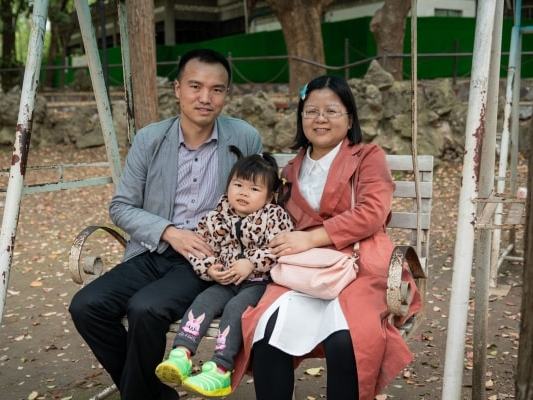 Zeng Yulin, with husband Zhang Dongyuan and daughter Zhang Yuewei, feels the family don’t earn enough to have a second child (The Washington Post)