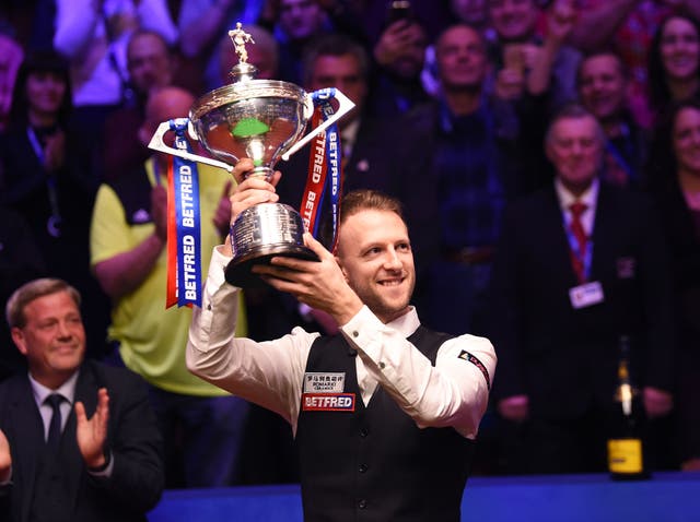 Judd Trump celebrates as he wins the 2019 Betfred World Snooker Championship