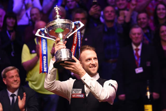 Judd Trump celebrates as he wins the 2019 Betfred World Snooker Championship