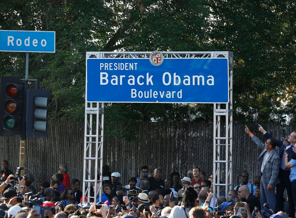Los Angeles City officials unveil the Obama Boulevard sign during a festival and unveiling ceremony