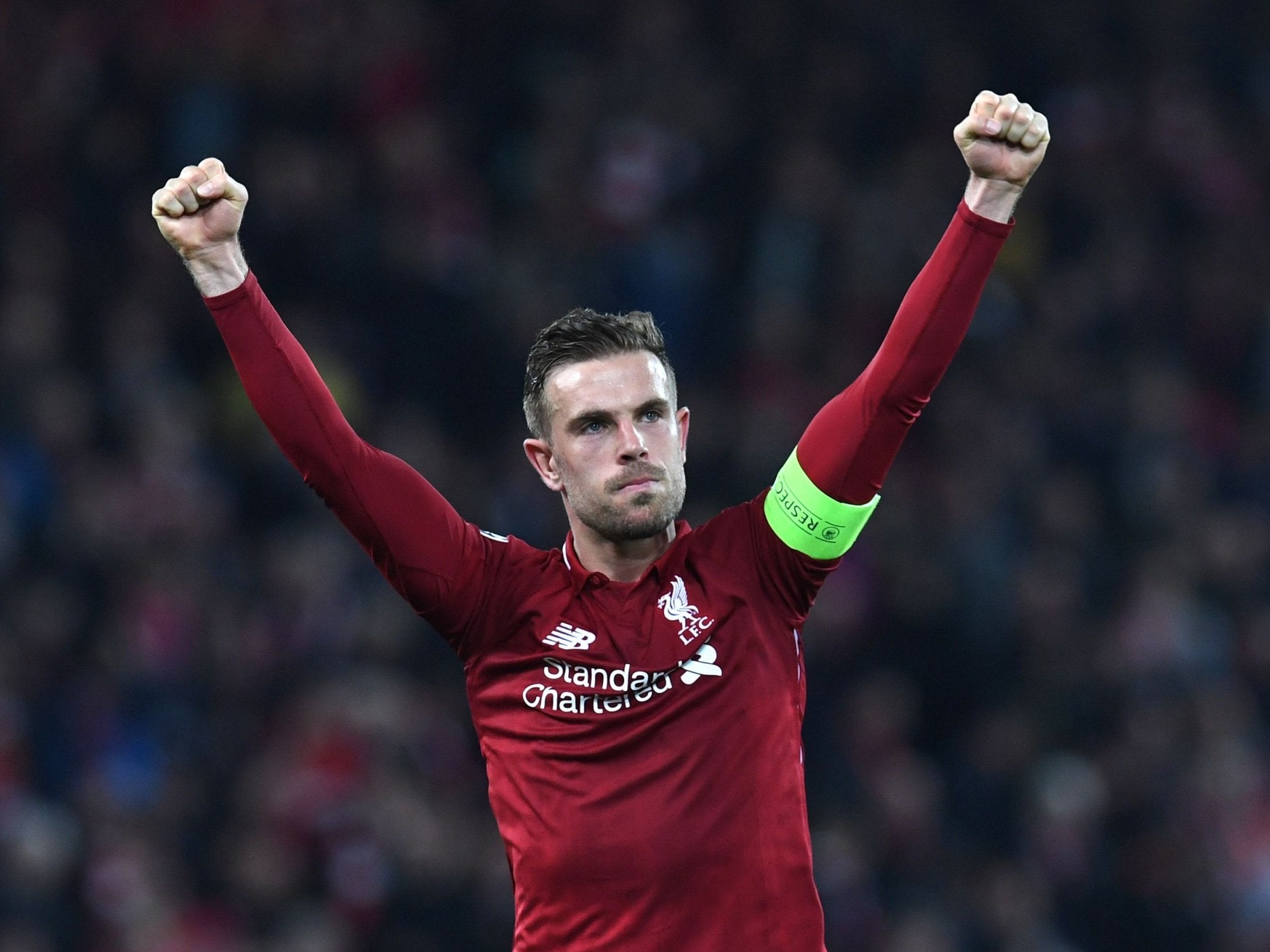 Jordan Henderson celebrates after the final whistle at Anfield