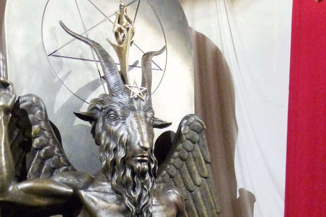 <p>A one tonne, seven foot bronze statue of Baphomet - a goat-headed winged deity - is displayed by the Satanic Temple in Salem, Massachusetts</p>