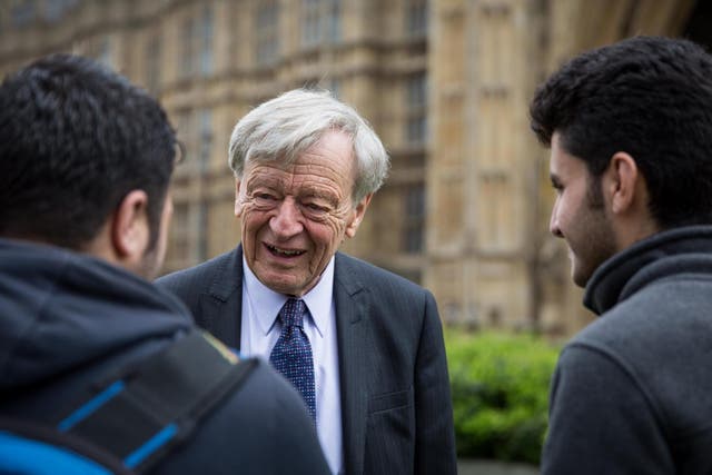 Lord Alf Dubs speaks to two child refugees from Syria