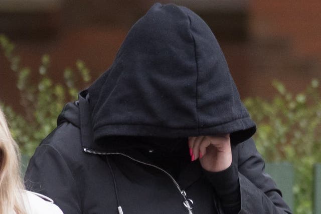 Hannah Cobley, 29, leaves Leicester Crown Court where she denies murdering her unnamed infant in April 2017 while she was living at a farm in Leicestershire.