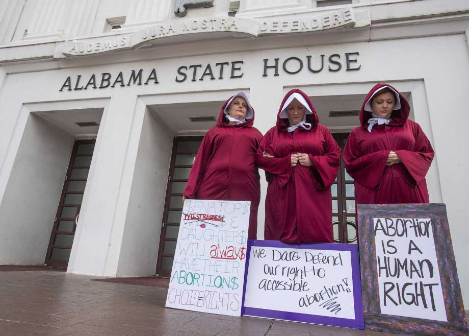 Activists for abortion rights protest outside the Alabama statehouse in Montgomery