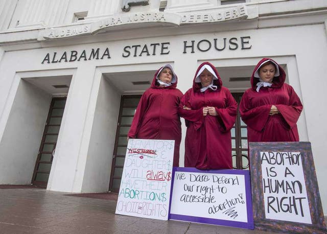 Abortion rights activists outside the Alabama statehouse in Montgomery