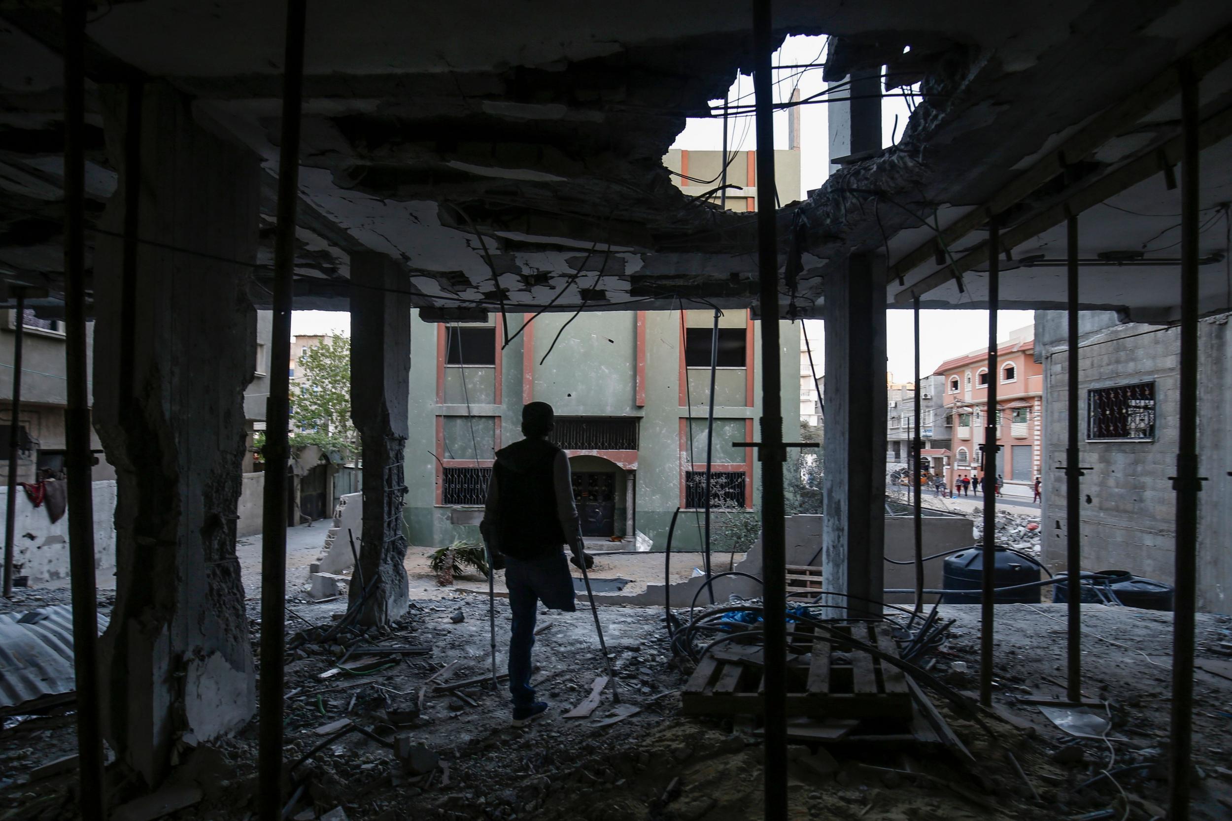 A Palestinian stands amid the rubble of a community centre in Rafah that was destroyed in a recent confrontation between Hamas and Israel (AFP/Getty)