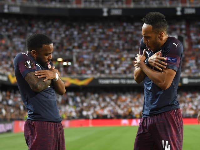 Pierre-Emerick Aubameyang celebrates scoring with Alexandre Lacazette in Arsenal's victory over Valencia