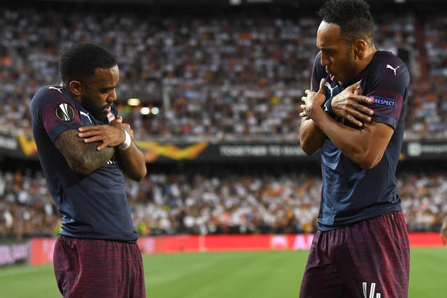 Pierre-Emerick Aubameyang celebrates scoring with Alexandre Lacazette in Arsenal's victory over Valencia