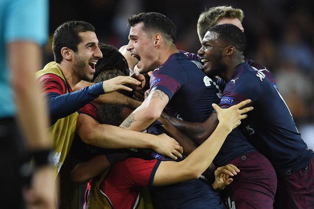 Arsenal celebrate their triumph over Valencia