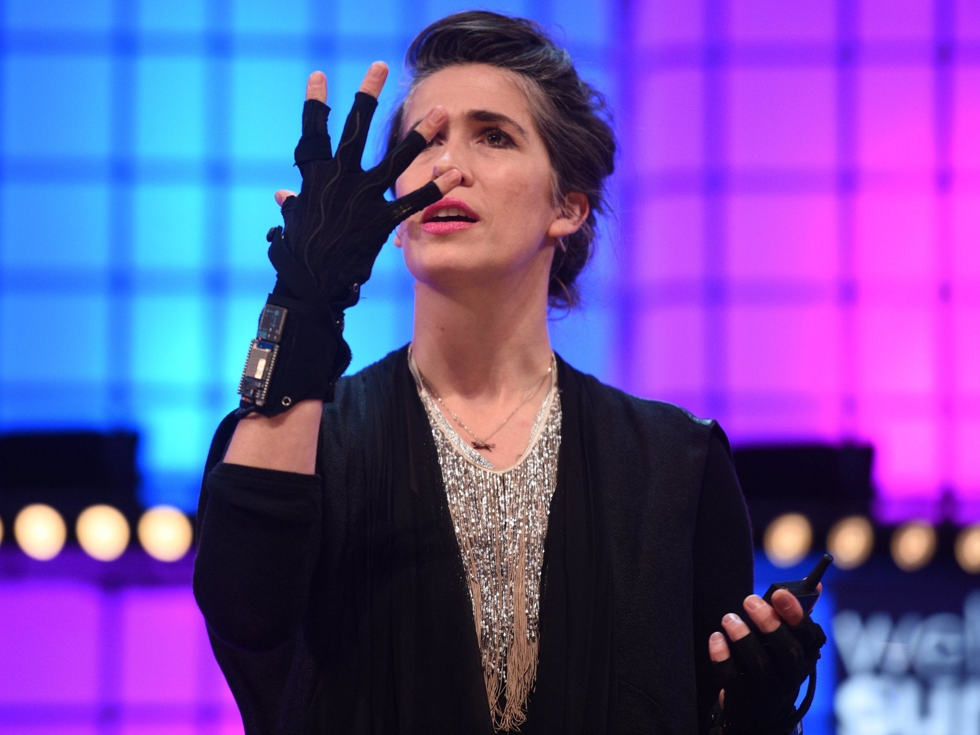 Imogen Heap presents the glove to a summit in Lisbon last year (Getty)