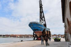 Migrant ship in which hundreds drowned goes on display in Venice