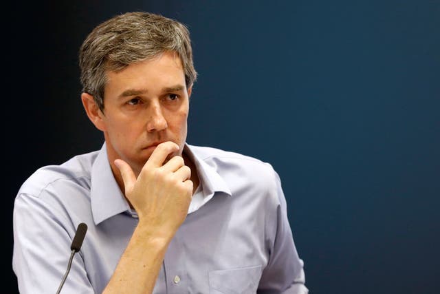 Democratic presidential candidate and former Texas Congressman Beto O'Rourke listens to a speaker during a roundtable discussion on climate change