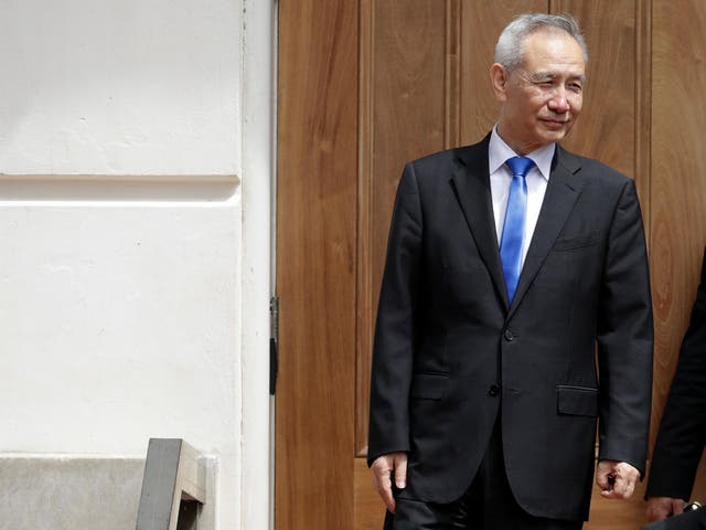 Liu He leaves meetings at the US Trade Representative offices on Friday