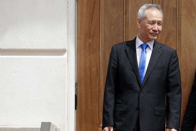Liu He leaves meetings at the US Trade Representative offices on Friday