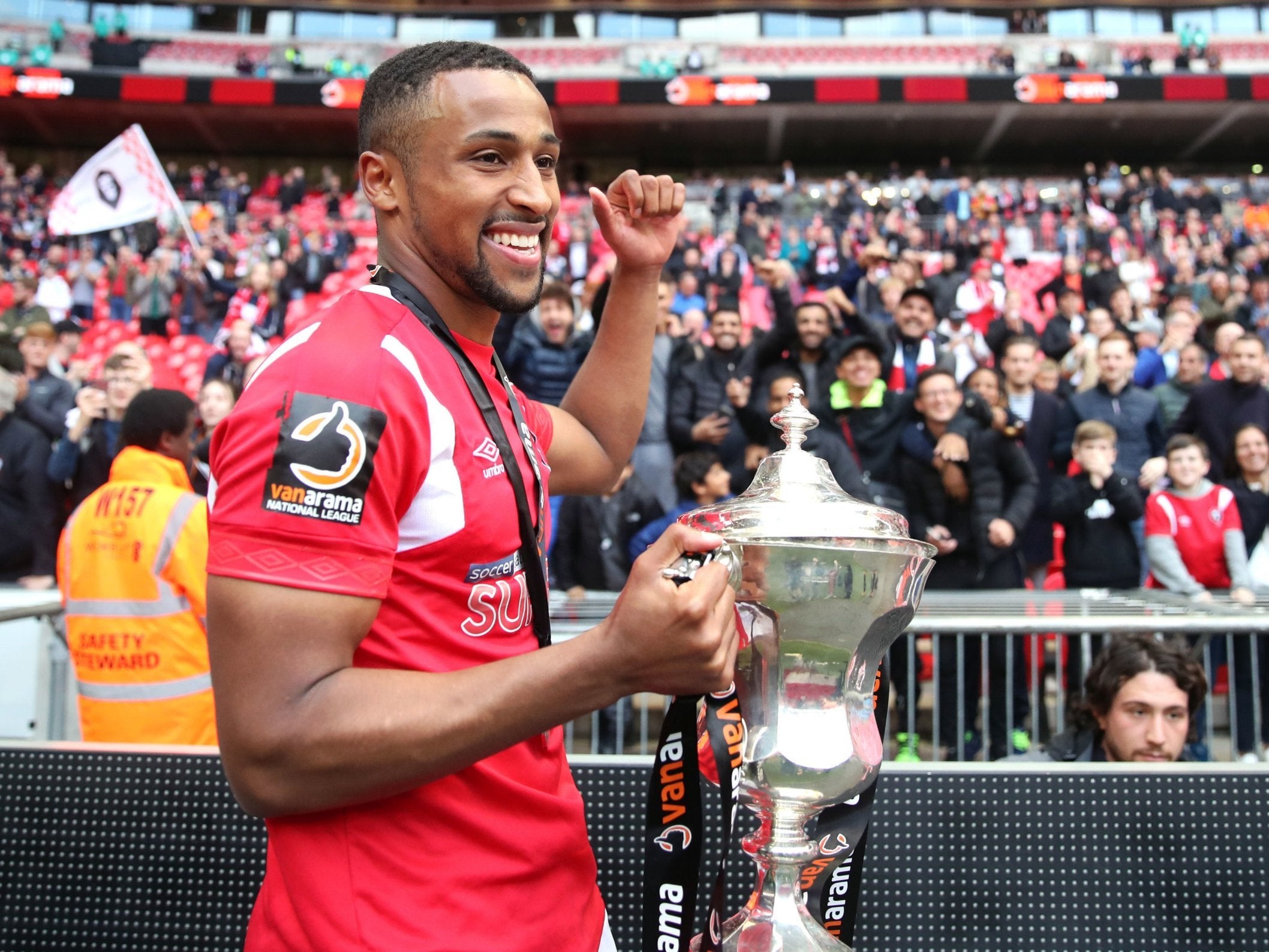 Ibou Touray with the trophy after winning the National League play-off final